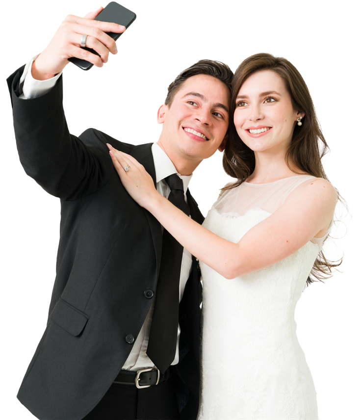 A bride and groom taking a selfie.